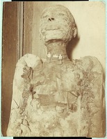 Mummy with amulets around its neck: Mummy of a priest of Amen. 21st Dynasty.