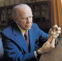 Raymond Arthur Dart examining skull